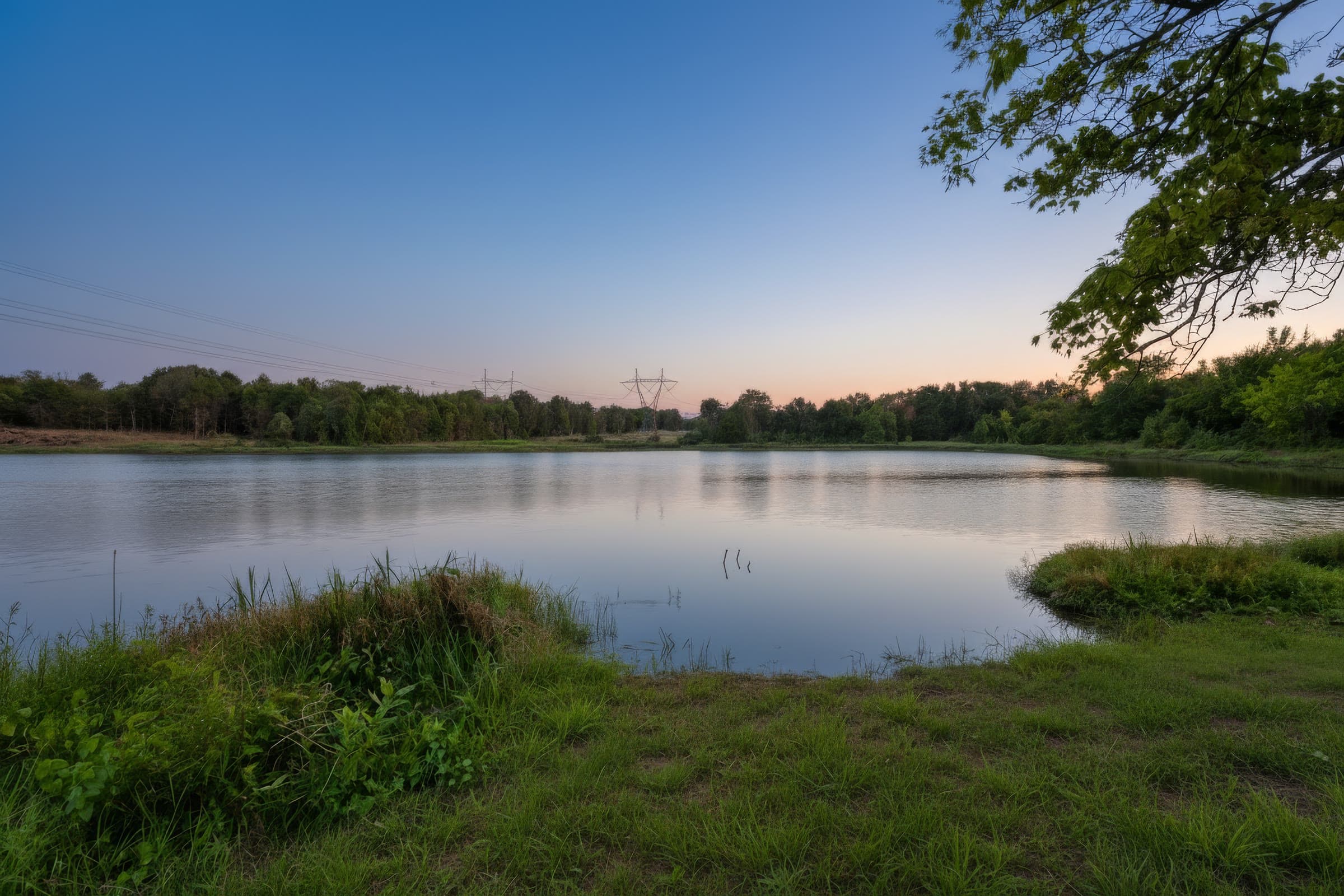Still water on the 14-acre lake at Bloom Estates